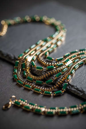 Necklace with green stones on black backgroundの写真素材