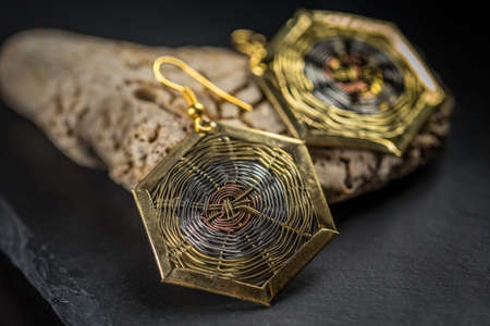 A pair of earrings on black backgroundの写真素材