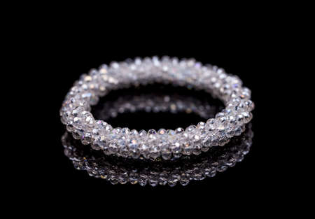 Bracelet with glass stones on black clipping path backgroundの写真素材
