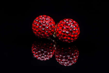 Earrings with stones on black clipping path backgroundの写真素材