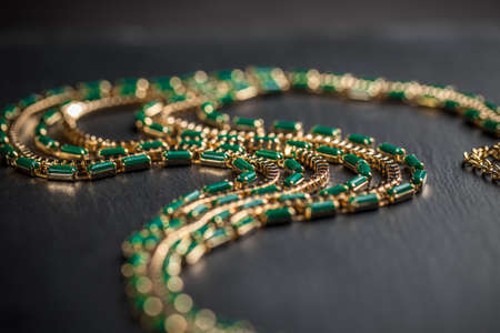 Close up of necklace with green stonesの写真素材
