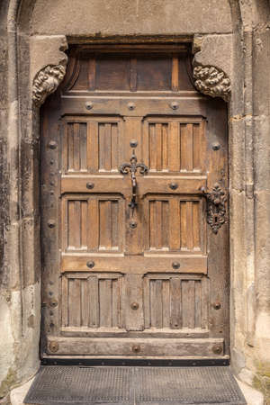 Vintage door on grunge stone wallの写真素材