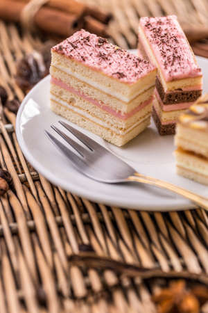 Layered mini cakes served on white plateの写真素材
