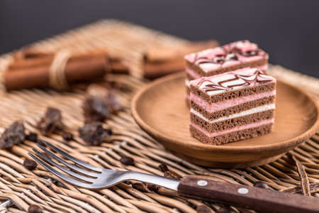 Decorative layered desserts on white plateの写真素材