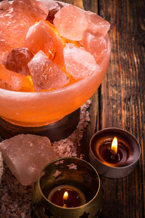 Close up of glow salt lamp and candleの写真素材