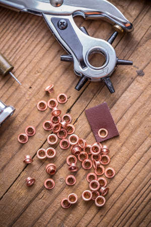 Round nose handy revolving hole punch tool with eyelet ringsの写真素材