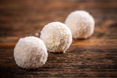 White chocolate candy coconut truffles in row
