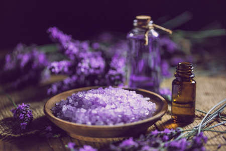 Essential oil and lavender bath salt with fresh flowersの写真素材