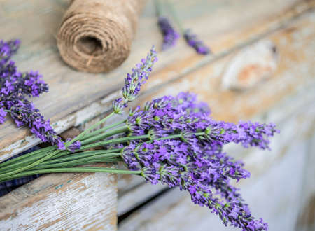 Bunch of lavender flowers on a wooden backgroundの写真素材