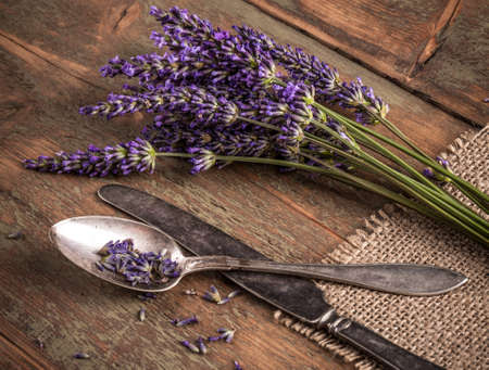 Bunch of lavender flowers on a wooden backgroundの写真素材