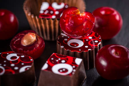 Chocolate candy with cherry, close up shotの写真素材