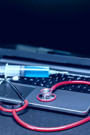 Stethoscope on laptop, close-up shot