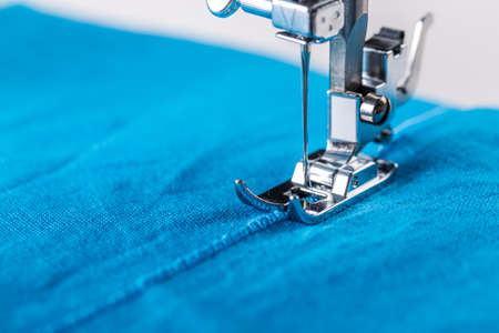Close-up of sewing machine and fabric