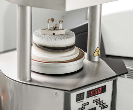 Oven and press for ceramic dental prostheses, in actionの写真素材