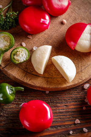Round delicious cheese covered with red wax