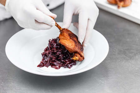 Crusty duck leg with braised red cabbageの写真素材