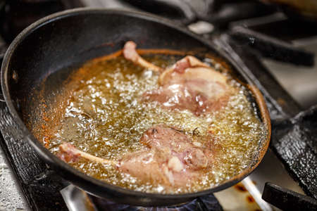 Duck leg roasted in a panの写真素材