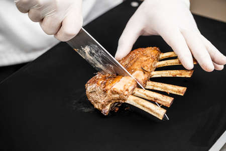 Rack of lamb sliced by chefの写真素材