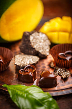 Gourmet chocolate praline with truffle and mango