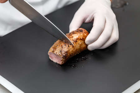 Pork loin roast sliced by chef