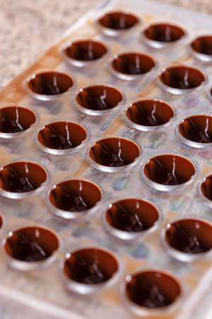 Making homemade sweets, chocolate in formsの写真素材