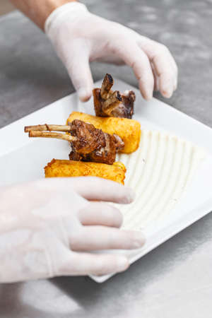 Rack of lamb with mashed potato-filled croquettesの写真素材