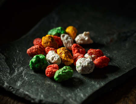 Delicious hazelnut sweets on dark slate