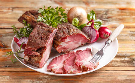 Smoked ham sliced for cold plateの写真素材