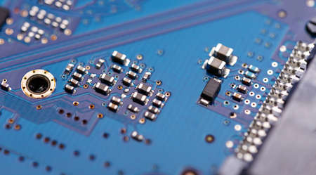 Microprocessor on blue circuit board representative of the high tech industry and computer science