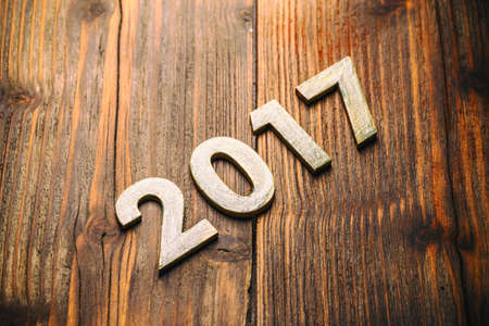 Happy New Year 2017 on a vintage wooden  backgroundの写真素材