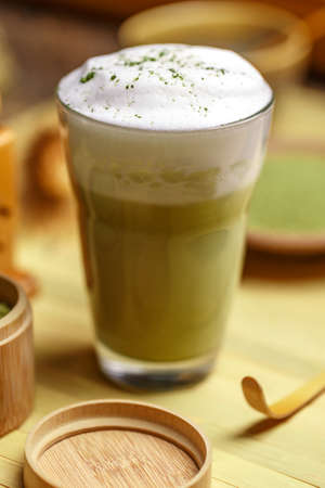 Green tea matcha latte in a glass cup 
