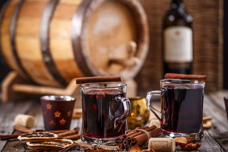 Glasses of mulled wine on wooden tableの写真素材