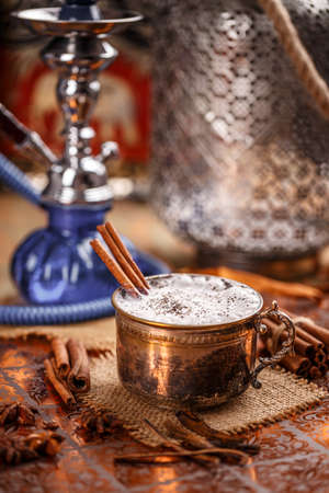 Chai latte, a spiced black Chinese tea blended with milk and exotic spiecesの写真素材