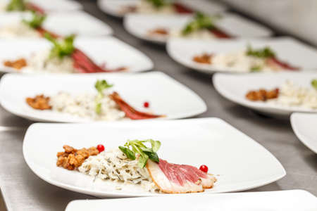 Sugar-cured smoked goose breast with black radish salad and goose cracklings