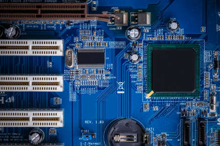 Blue electronic circuit board close up shot