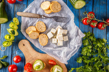Top view of bruschetta and salted feta cheese cubeの写真素材
