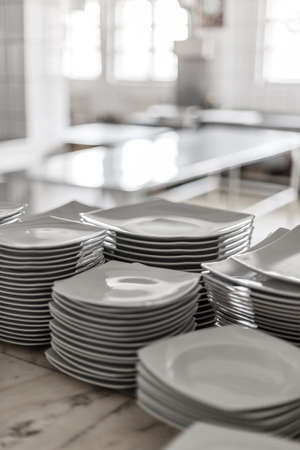 Stack of many white different platesの写真素材