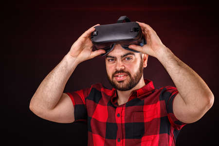 Young man using VR glasses headset