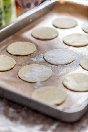Raw dough for cookies on baking tray, closeup