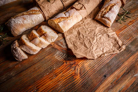 Crusty cereal baguettes in a rustic compositionの写真素材