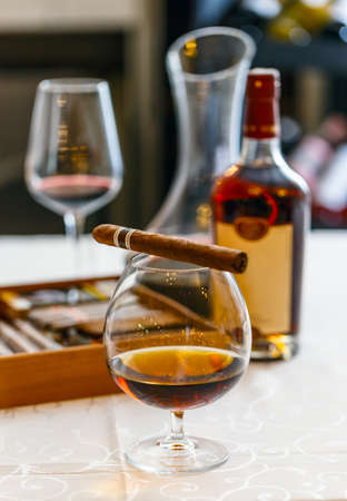 Quality cigars and cognac on the tableの写真素材