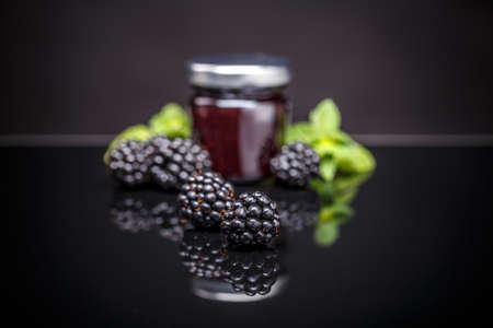 Blackberry jam in a jar. Homemade fruit jamの写真素材