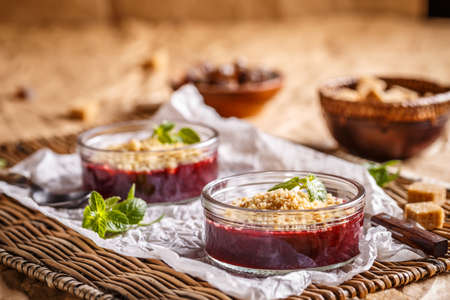 Traditional English cherry crumbles in small glass bowlの写真素材