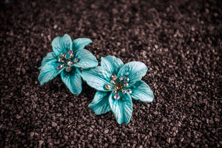 Blue jewellery flowers on black backgroundの写真素材