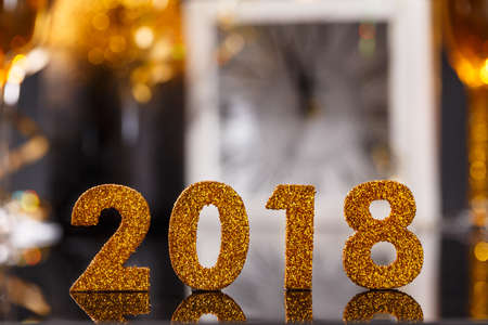 2018 year golden figures on reflection background