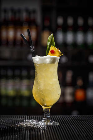 Pina colada cocktail on a bar counterの写真素材