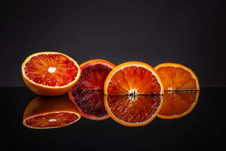 Fresh blood orange on clipping path black background