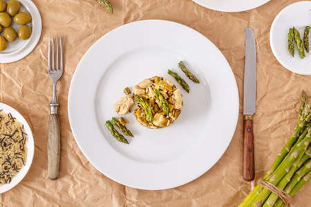 Risotto with asparagus and chicken breast meatの写真素材