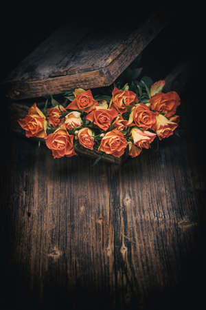 Lovely rose flowers on wooden table, rustic designの写真素材