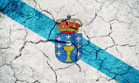 Galicia, autonomous community of Spain, flag on dry earth ground texture backgroundの写真素材